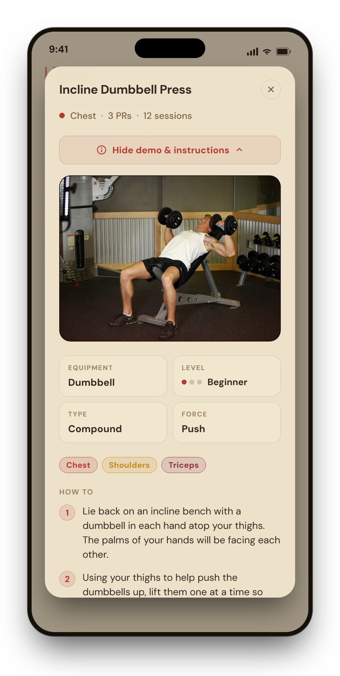 The exercise detail screen for Incline Dumbbell Press with a demo photo, Equipment, Level, Type and Force facts, muscle chips, and numbered how-to steps.